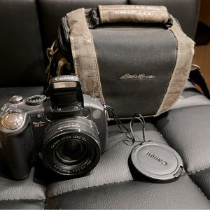 canon powershot s5 is with 2 lens covers and bag